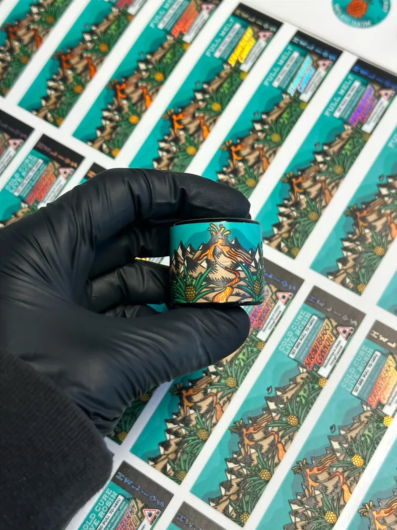 Labeled jar in glove over label sheet
