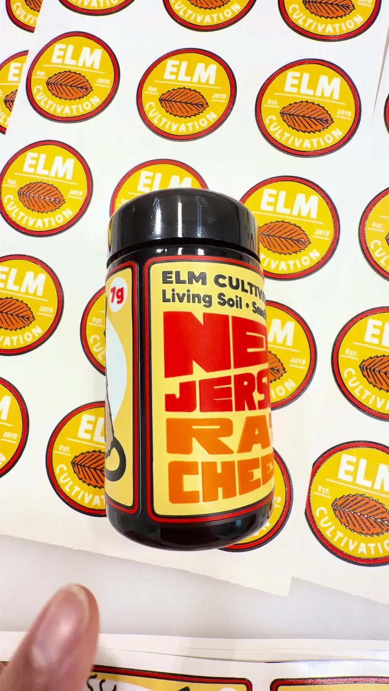 Labeled jar over ELM round stickers
