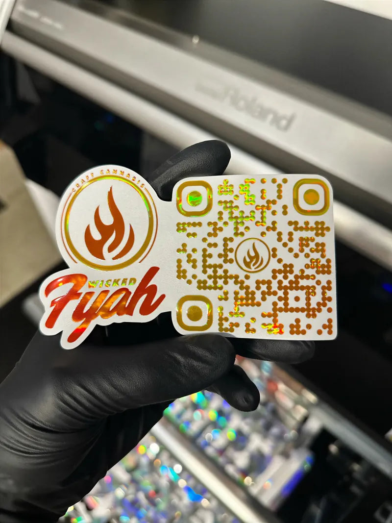 Fyah foil sticker in glove at printer